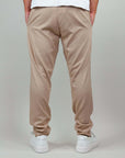 Retro view of beige linen-rayon blend pants, showcasing comfort and breathability, styled for warm weather wear.