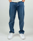 Jeans Jack&Jones Eddie Baggy in blue, loose fit, 100% cotton, modeled on person wearing size 31, with white sneakers.