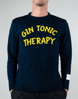 Maglia Girocollo Gin Tonic Therapy worn by a model, featuring bold 'GIN TONIC THERAPY' lettering on a navy blue sweater.