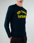 Maglia Girocollo Gin Tonic Therapy displayed on a model showcasing its vibrant yellow text and stylish design.