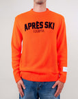 Maglione girocollo Superculture Apres Ski (Art. AK5017) in arancione fluo, con scritta Apres Ski sul davanti.