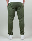 Rear view of olive green linen-rayon blend pants, showcasing their stylish and comfortable fit.