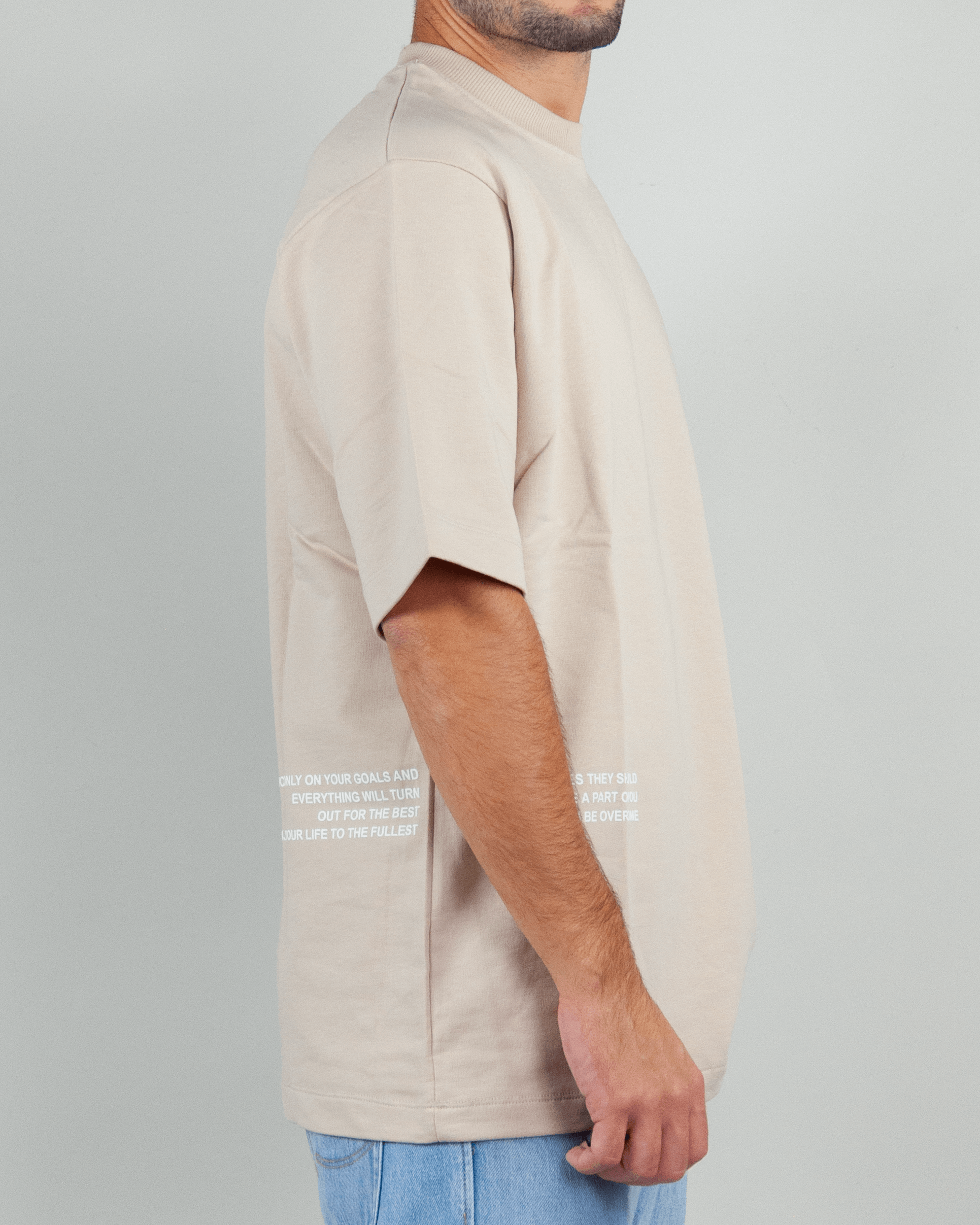 T-shirt in felpa Berna displayed on a model, showcasing its relaxed fit and stylish design in a beige color.