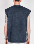 Back view of a man wearing a Muscle Tee Amish Art in charcoal color, showcasing the sleeveless design.
