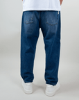 Back view of Jeans Coulisse Uomo in blue, featuring a relaxed fit and cuffed hems.