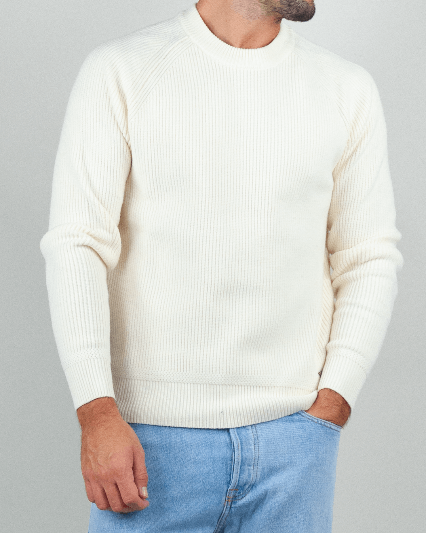Gianni Lupo Maglia Costine in cream color, ribbed texture, worn by a man with jeans.