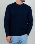Gianni Lupo Maglia Costine navy blue knit sweater model wearing it with light jeans.