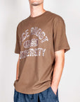 Model wearing a t-shirt amish with face ghost university design in brown color, showcasing a casual style.