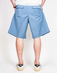 Bermuda Fresco Lana Este Officina 36 Uomo Art. 0273700522 viewed from the back in light blue color.