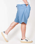 Bermuda Fresco Lana Este Officina 36 Uomo Art. 0273700522 shown on model walking, featuring light blue fabric.