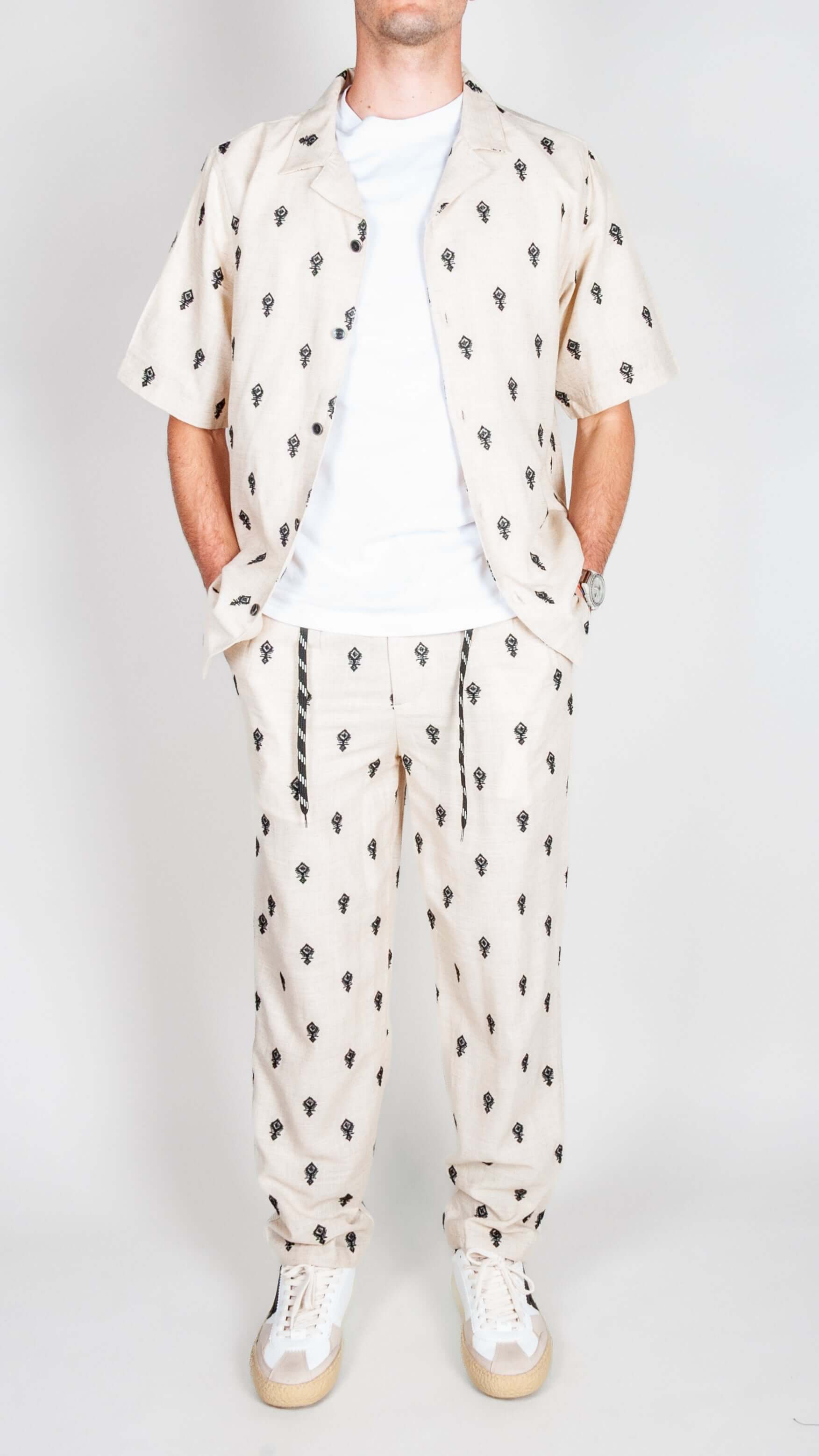 Completo Berna ricamo stylish outfit featuring shirt and pants with unique pattern.