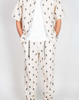 Completo Berna ricamo stylish outfit featuring shirt and pants with unique pattern.