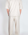 Completo Imperial misto lino - Beige, back view of a man wearing a stylish beige linen suit.