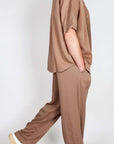 Completo in Lyocell Double Label Cammello worn by a model, showcasing a light brown outfit for casual style.