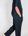 Completo in Lyocell Double Label Nero worn by a model, showcasing black fabric and relaxed style.