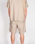 Completo lavorato Jack&Jones in beige, vista posteriore su modello maschile.