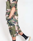 Completo Mimetico Why Not worn by a model, showcasing a stylish camo design and relaxed fit in casual wear.